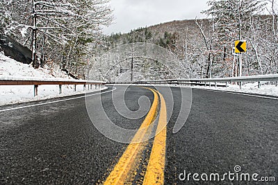 Beautiful winter landscape with highway road with turn and snow-covered trees. Stock Photo