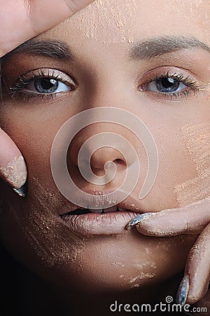 Beautiful woman applying female makeup powder Stock Photo