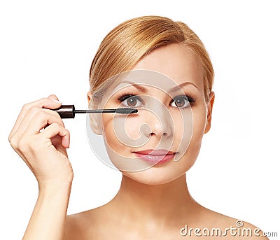 Beautiful woman applying mascara on her eyelashes, isolated Stock Photo