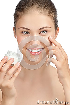Beautiful woman applying moisturizer cream Stock Photo