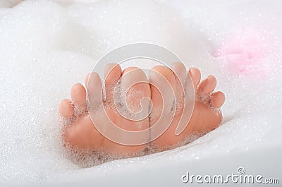 Beautiful woman in bath foam beauty health legs fingers Stock Photo