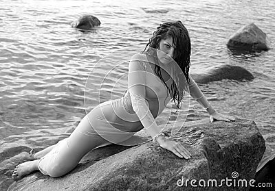 https://thumbs.dreamstime.com/x/beautiful-woman-bathing-suit-lying-water-beach-31247289.jpg