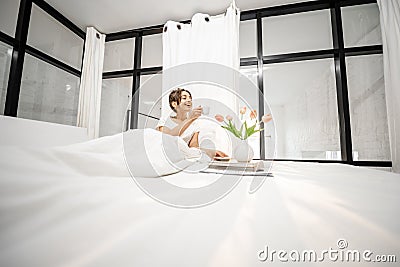 Beautiful woman in bedroom Stock Photo