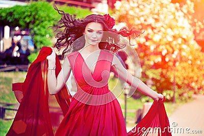 Beautiful woman in a bright red dress Stock Photo