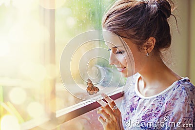 Beautiful woman with butterfly Stock Photo
