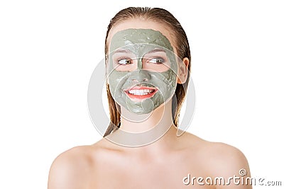 Beautiful woman with clay facial mask, isolated on white Stock Photo