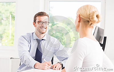 Beautiful woman consulting a man in the office Stock Photo