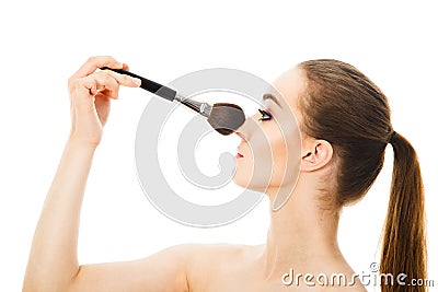 Beautiful woman with cosmetic brushes isolated Stock Photo