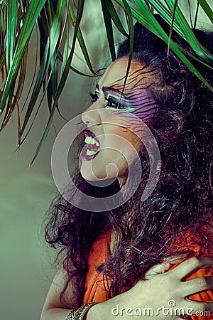 Beautiful woman with creative tiger style make-up Stock Photo