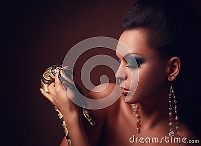 Beautiful Woman with dangerous snake Stock Photo