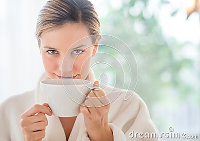 Beautiful Woman Drinking Coffee In Health Spa Stock Photo