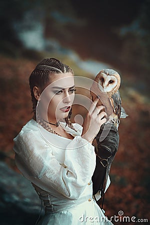 Beautiful woman with elegant barn owl Stock Photo