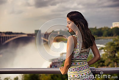 Beautiful woman enjoing the view of Niagara Fall Stock Photo