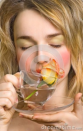 Beautiful woman enjoying the rose and water Stock Photo