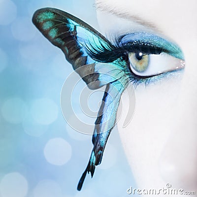 Beautiful woman eye close up with butterfly wings Stock Photo