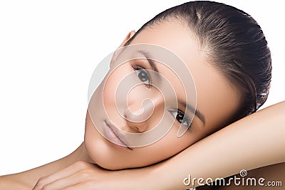 Beautiful woman face close up portrait studio on white. head on hand, looking at camera, spa, fresh clean skin Stock Photo