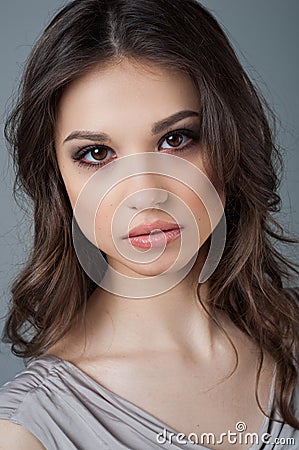 Beautiful woman face close up portrait young studio on gray. Natural beauty Stock Photo