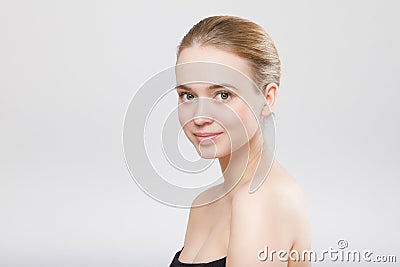Beautiful woman face close up studio on grey Stock Photo