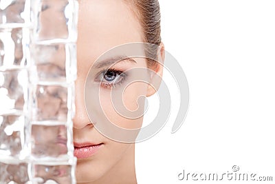 Beautiful woman face near ice cubes Stock Photo