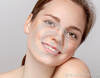 Beautiful woman face portrait young gray background Stock Photo