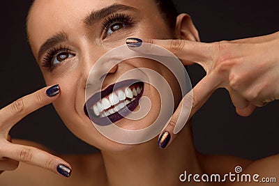 Beautiful Woman With Fashion Makeup, Dark Lips, Stylish Nails Stock Photo
