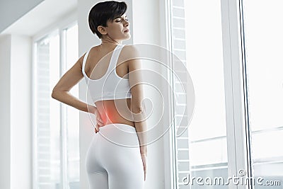 Beautiful Woman Feeling Pain In Back, Backache. Health Issue Stock Photo