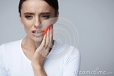 Beautiful Woman Feeling Tooth Pain, Painful Toothache. Health Stock Photo