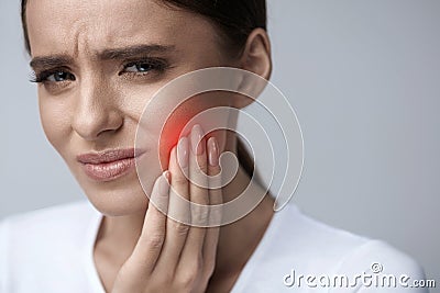 Beautiful Woman Feeling Tooth Pain, Painful Toothache. Health Stock Photo