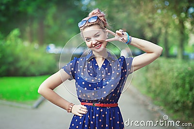 Beautiful woman in fifties style with braces winking Stock Photo