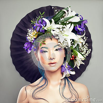 Beautiful Woman with Flower on her Head and Creative Makeup Stock Photo