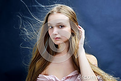 Beautiful woman with flying long hair. Stock Photo