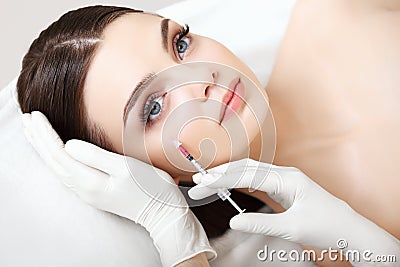 Beautiful Woman gets Injection In Her Face. Cosmetic Surgery Stock Photo