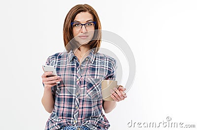 Beautiful woman with glasses holding mug smartphone. Young lady drinking tea and using gadget. Break concept. Isolated side view Stock Photo