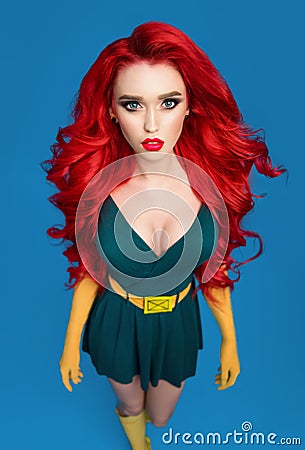 Beautiful woman in green superhero costume Stock Photo