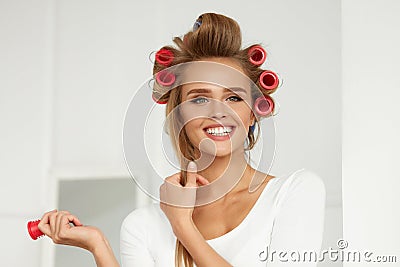 Beautiful Woman With Hair Curlers, Hair Rollers On Healthy Curly Stock Photo