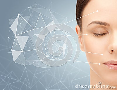 Beautiful woman half face with low poly projection Stock Photo