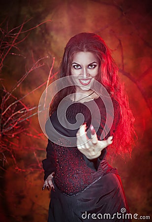 Beautiful woman in halloween style beckoning finger Stock Photo