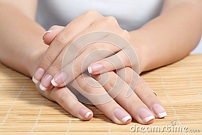 Beautiful woman hands and nails with perfect french manicure Stock Photo