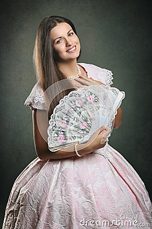 Beautiful woman historical dress with floral fan Stock Photo