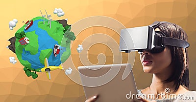 Beautiful woman holding digital tablet and looking at 3d image of earth by using VR glasses Stock Photo