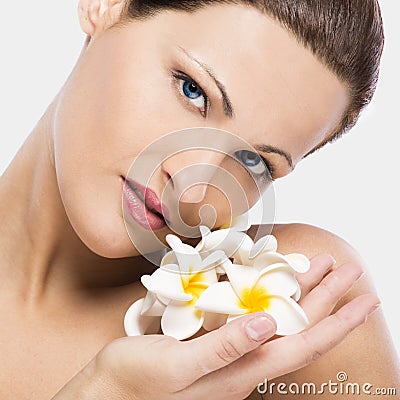 Beautiful woman holding flowers Stock Photo