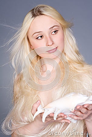 Beautiful woman holding seashell Stock Photo