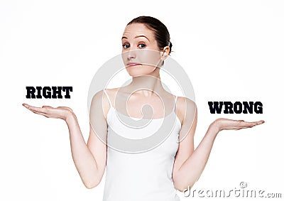 Beautiful woman holding words right and wrong Stock Photo