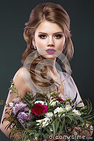 Beautiful woman in image of the bride with flowers. Beauty face and Hairstyle Stock Photo