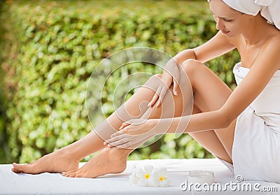 Beautiful Woman Legs And Cream. Stock Photo