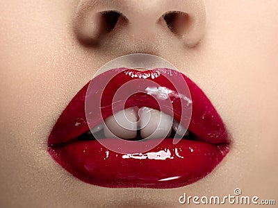 Beautiful woman lips with red lipstick closeup Stock Photo