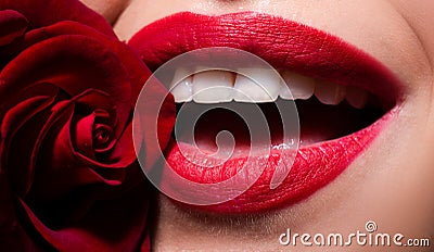 Beautiful woman lips with rose. Open mouth with white teeth. Cosmetology, drugstore or fashion makeup concept. Beauty Stock Photo