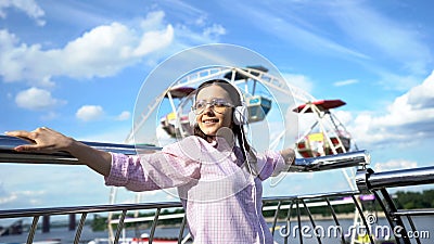 Beautiful woman listening to motivating audiobook in headphones, inspiration Stock Photo