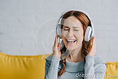 Beautiful woman listening to music and singing Stock Photo