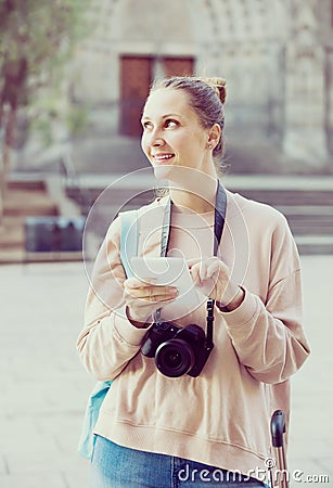 Beautiful woman looking for the map in the phone Stock Photo